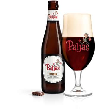 Paljas Bruin met schuimkraag in Paljas-glas met flesje ernaast